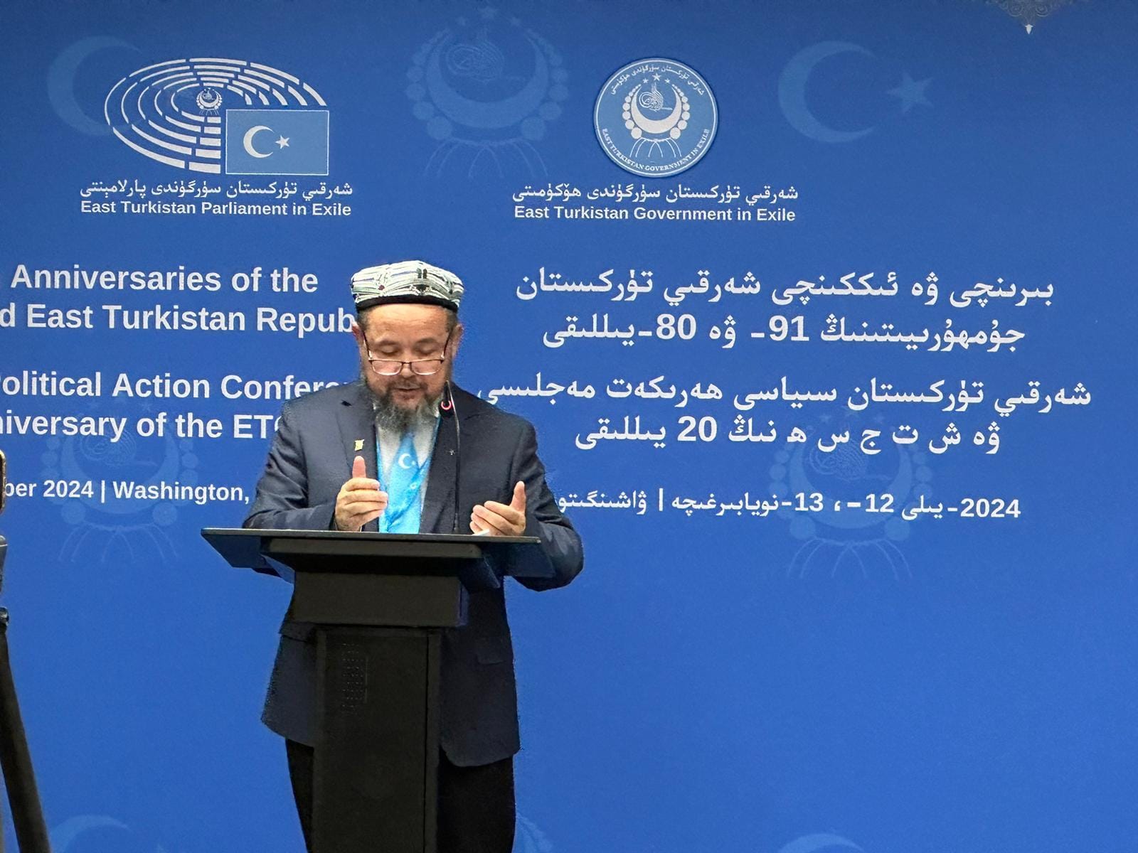 Abdulahad Nur speaking at a podium at a conference in Washington.
